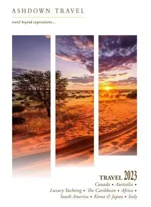 Ashdown Travel brochure with sunset over desert landscape. 