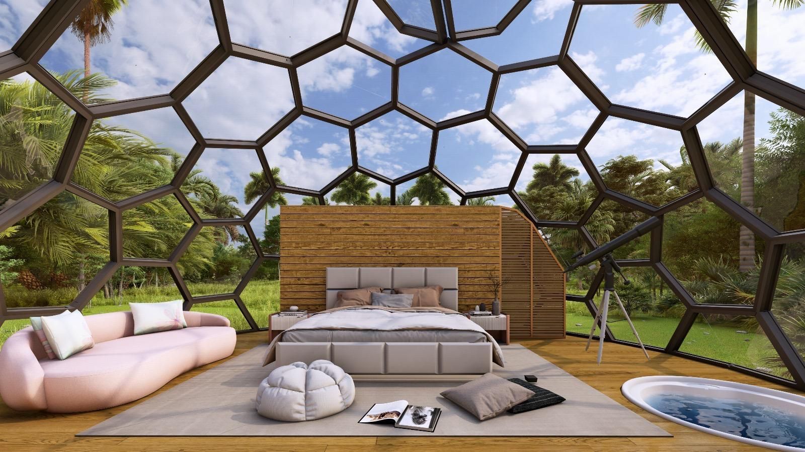 Un dormitorio con cama, sofá y jacuzzi en una cúpula.