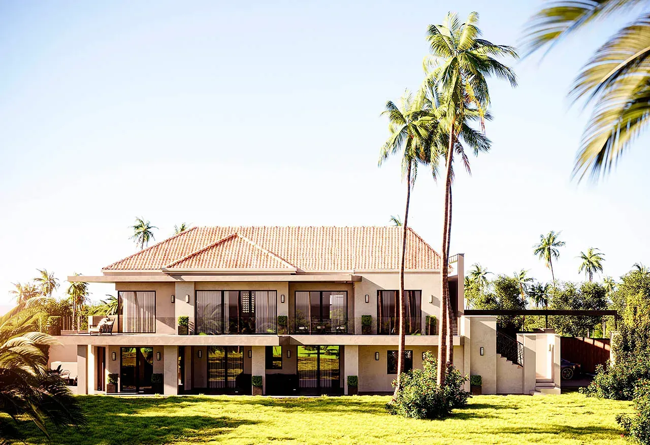 Moderna casa de dos pisos con techo de terracota, palmeras y césped bajo un cielo brillante.