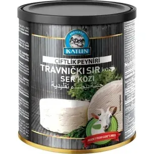 Queso de cabra enlatado de Katun. Lata negra y dorada con foto del producto, texto en varios idiomas e imagen de la cabra.