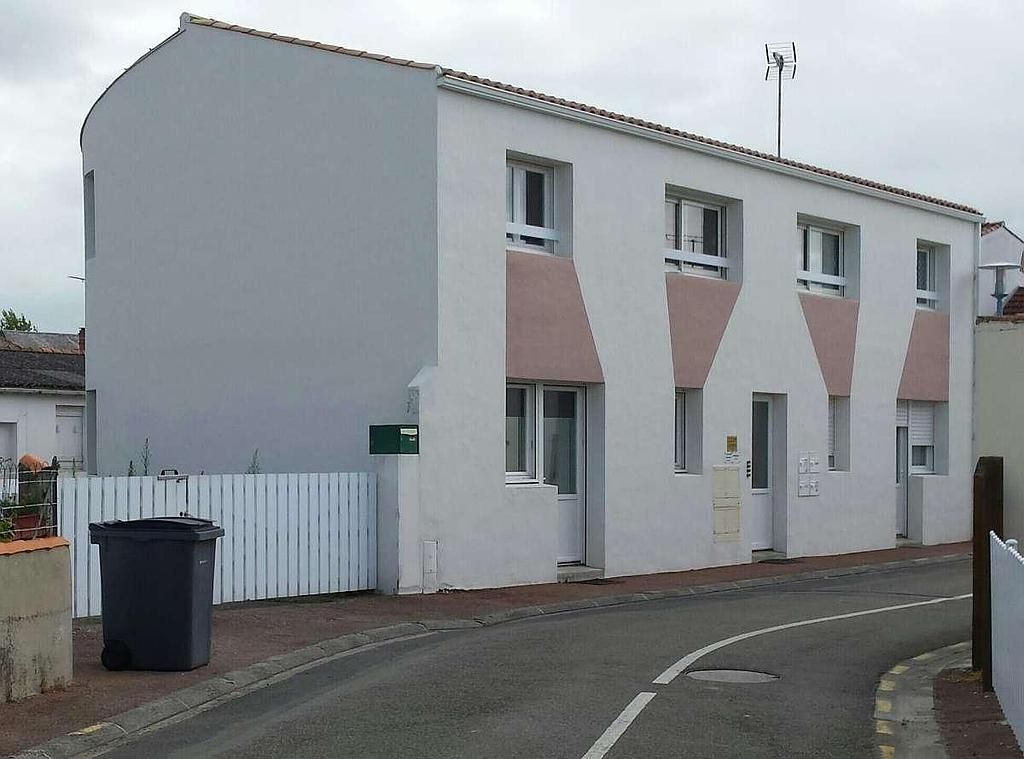 Restauration complète d'un bâtiment résidentiel avec trois logements