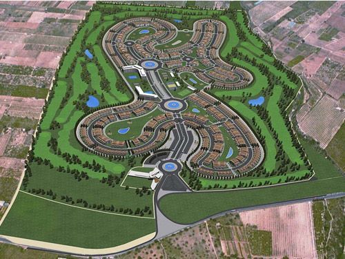 Una vista aérea de una zona residencial con un campo de golf.