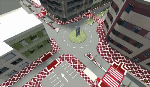 Una vista aérea de una intersección de la ciudad con una rotonda.