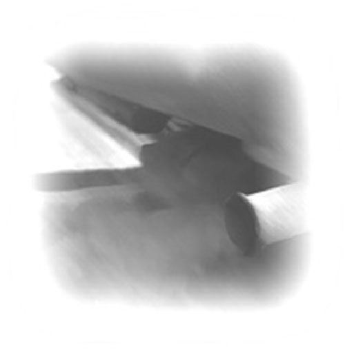 Una fotografía en blanco y negro de un tubo de escape de un automóvil del que sale humo.