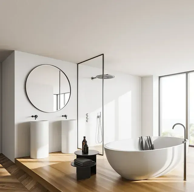 Un baño con bañera, lavabo y espejo.