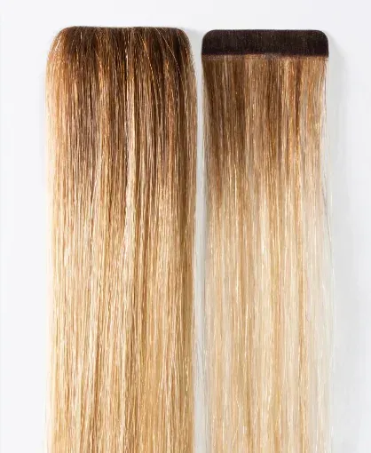 Dos tiras de extensión de cabello ombré, de castaño oscuro a rubio.