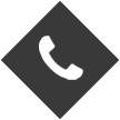 Icono de teléfono blanco centrado sobre un fondo gris oscuro en forma de diamante.