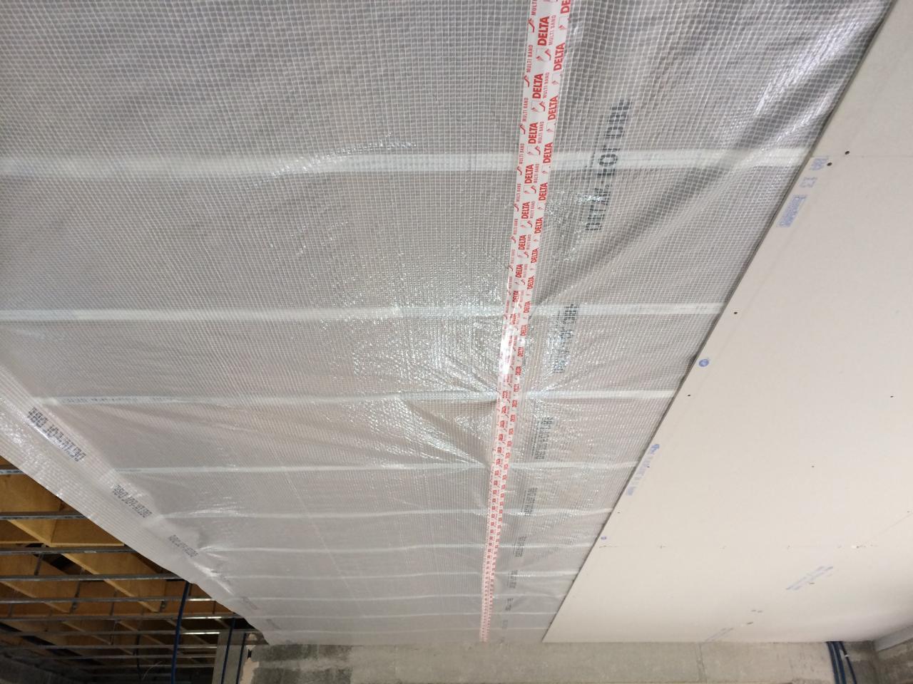 Pose de membrane pour l'isolation soufflée