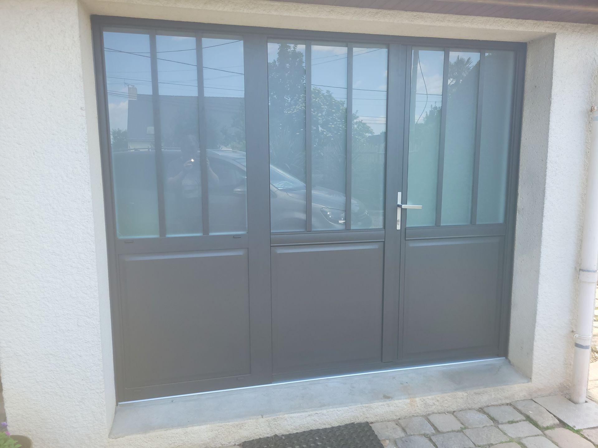 Porte de garage manuel avec des vitres