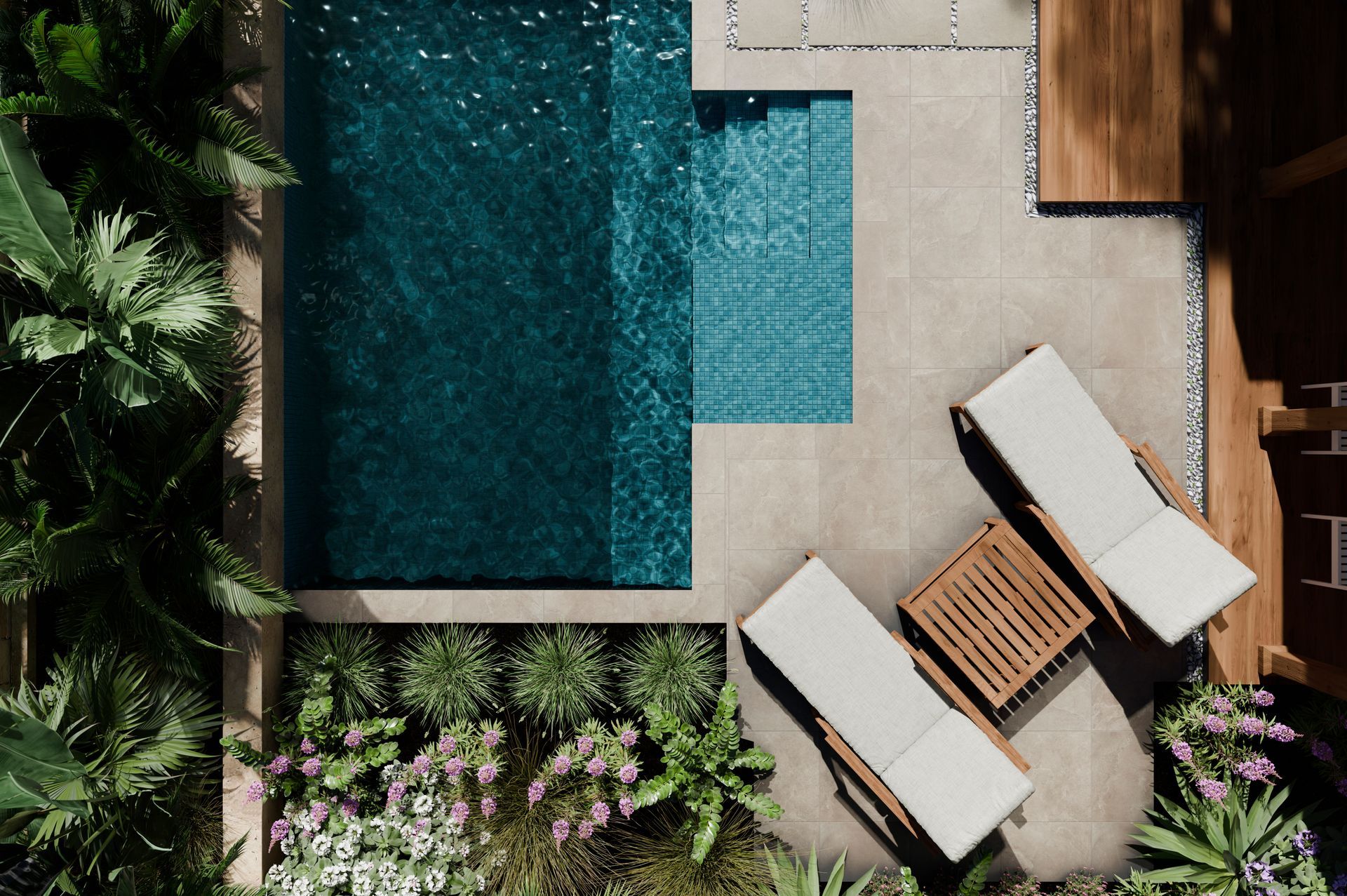 Vue aérienne d'une terrasse moderne au bord d'une piscine avec chaises longues, table et plantes tropicales.