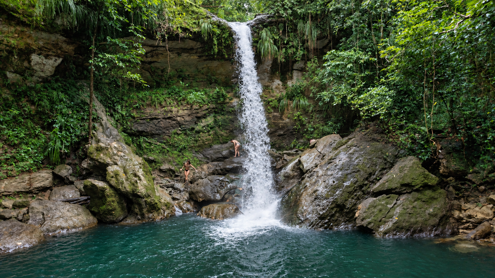 Waterfall flowing into a jungle lagoon
