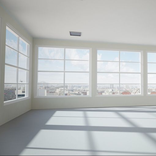 Una habitación vacía con muchas ventanas y vistas a la ciudad.