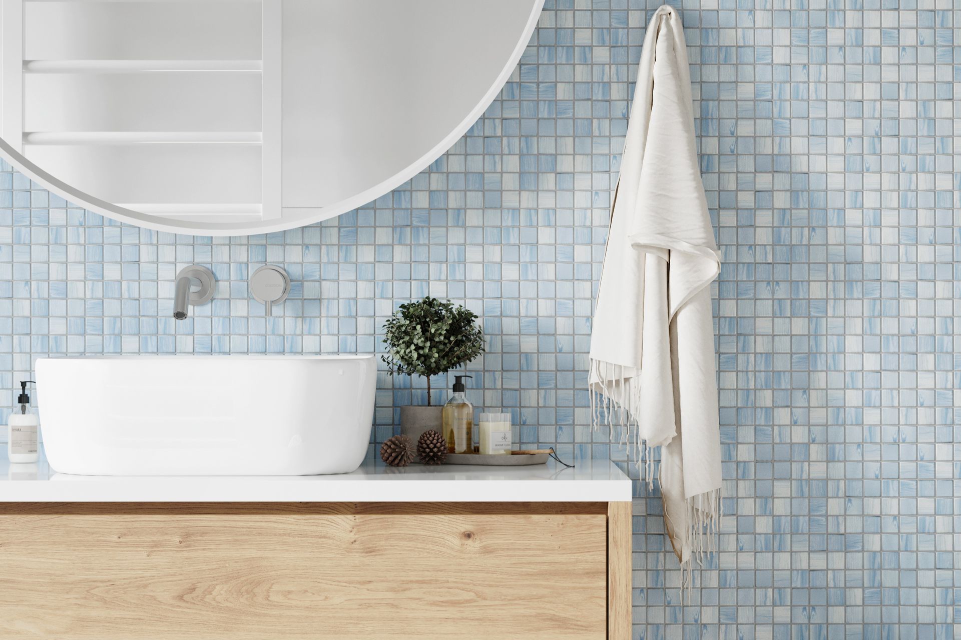 Une mosaïque dans une salle de bains avec vasque