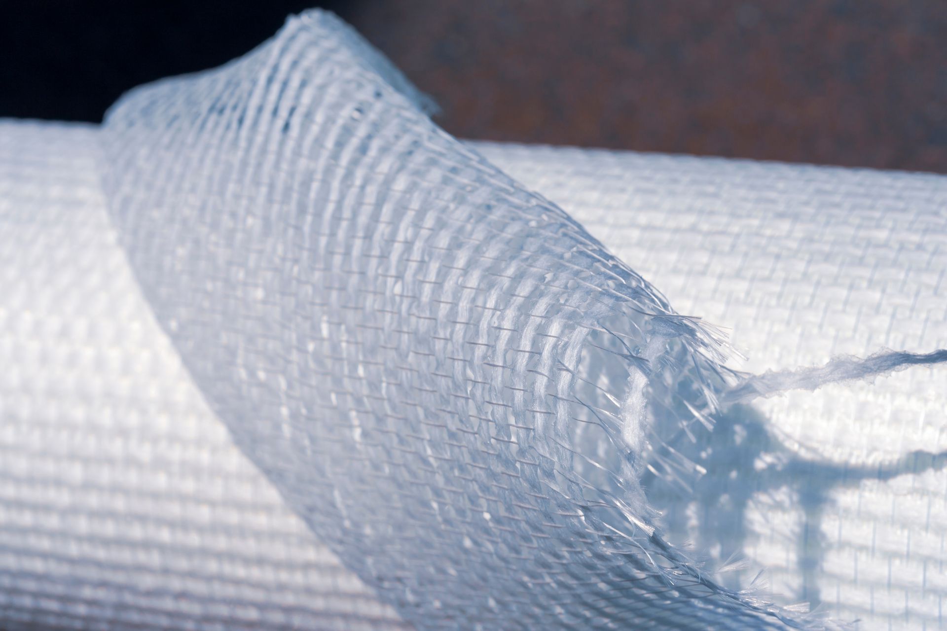 Zoom sur un rouleau de toile de verre