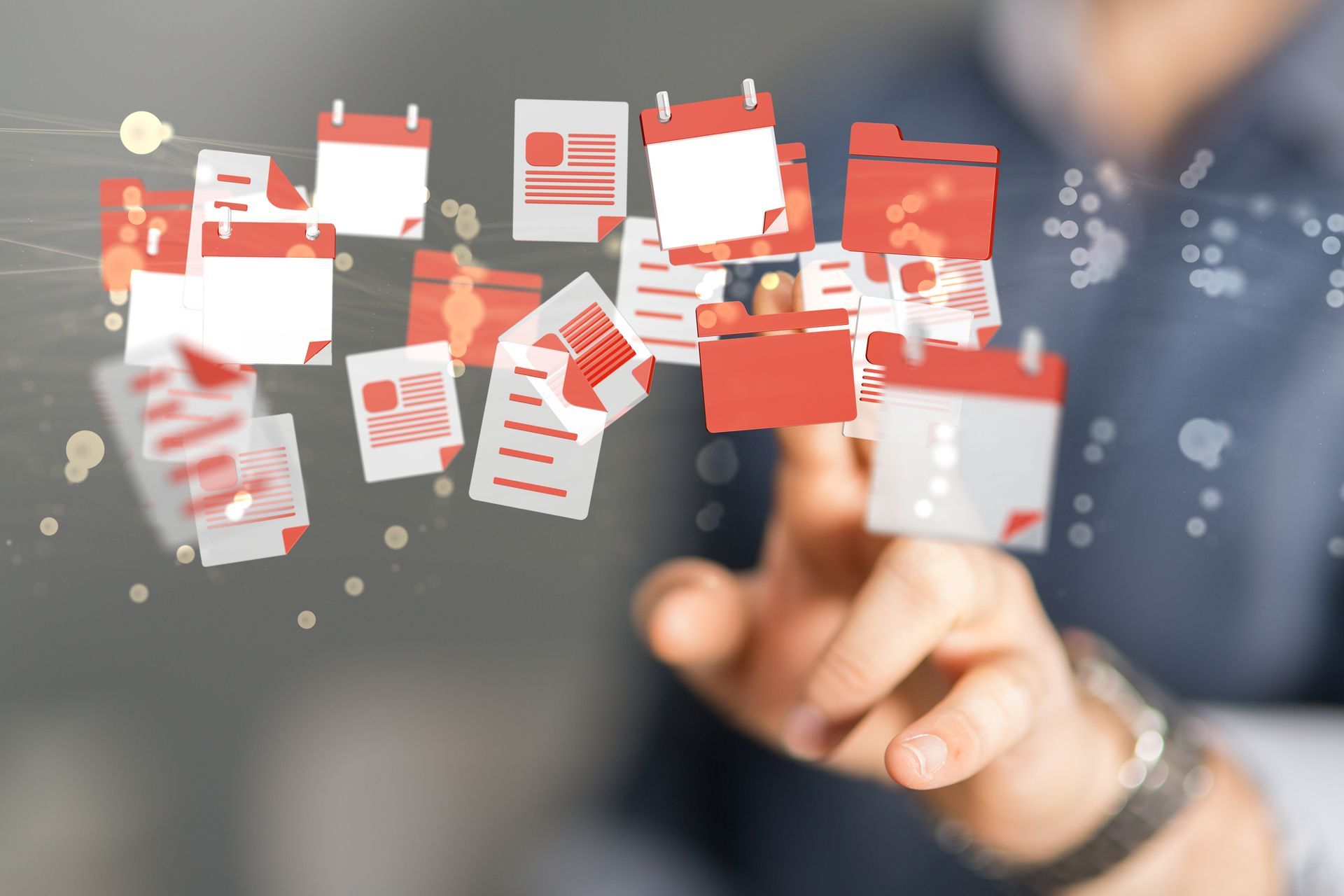 Une main touchant des documents et des calendriers rouges flottants évoque une organisation ou des données numériques.