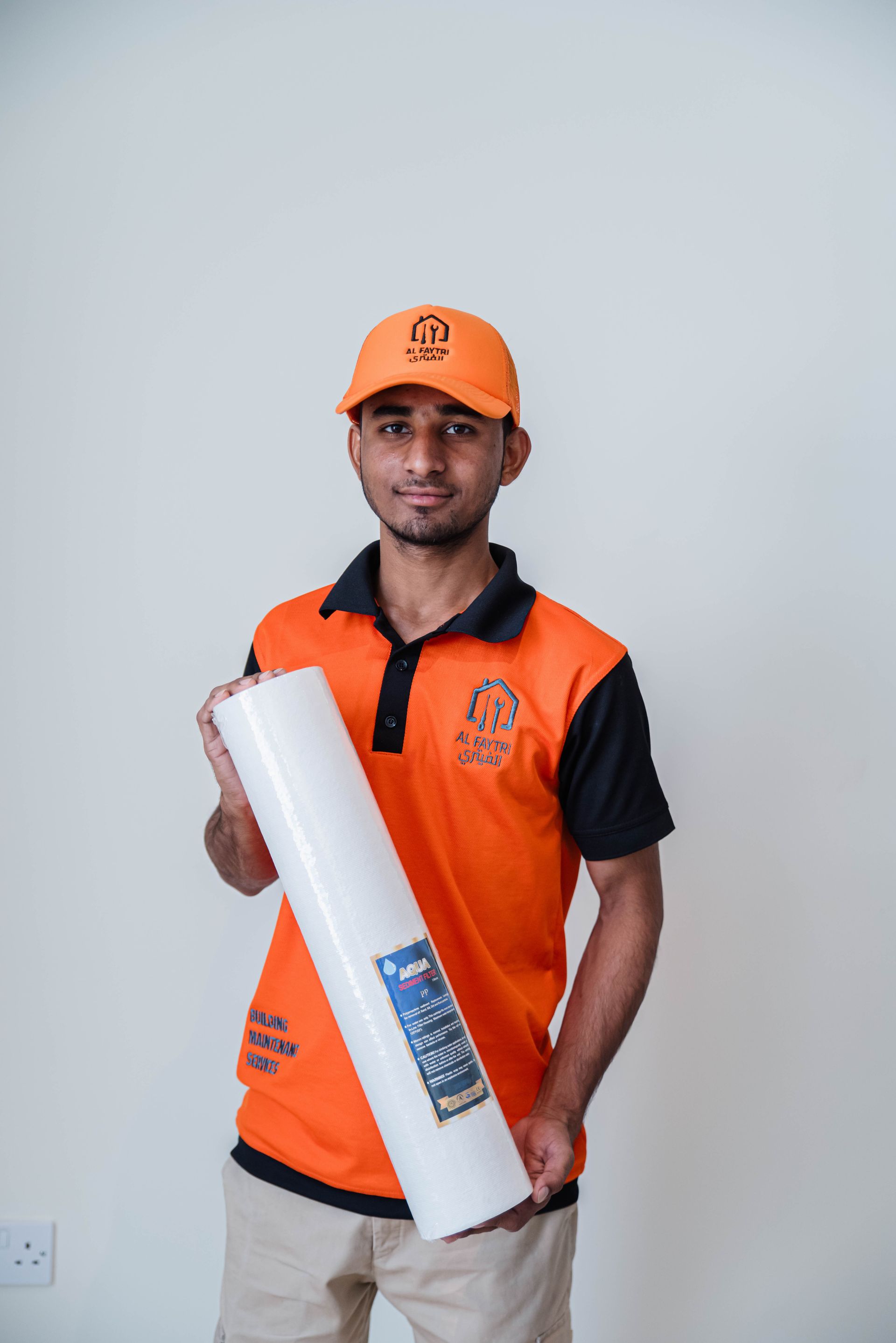 Company technicians group photo in uniforms – AC maintenance team in Qatar