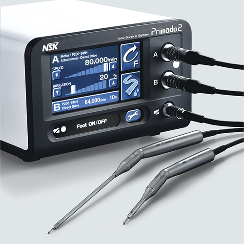 A nsk machine with two surgical instruments attached to it