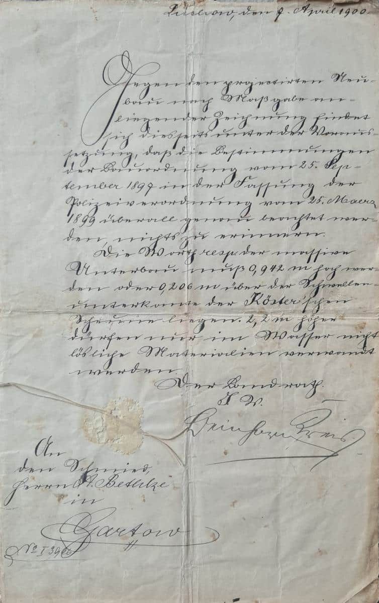 Verblasster, handgeschriebener Brief in Kursivschrift auf gealtertem Papier mit Unterschriften und Amtszeichen.