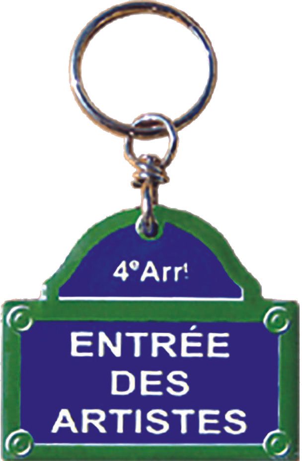 Porte-clés en forme de panneau de rue bleu et vert sur lequel on peut lire « Entrée des Artistes »