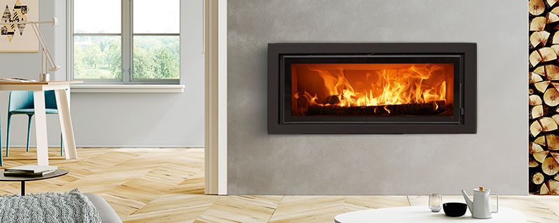 Exemple d'un chauffage au bois avec un insert en acier de la marque ESTUFA
