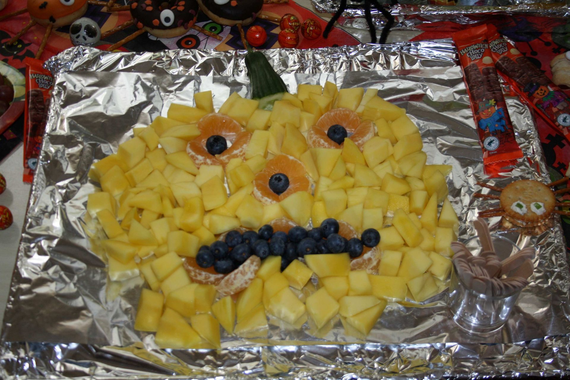A pumpkin made out of pineapple and blueberries