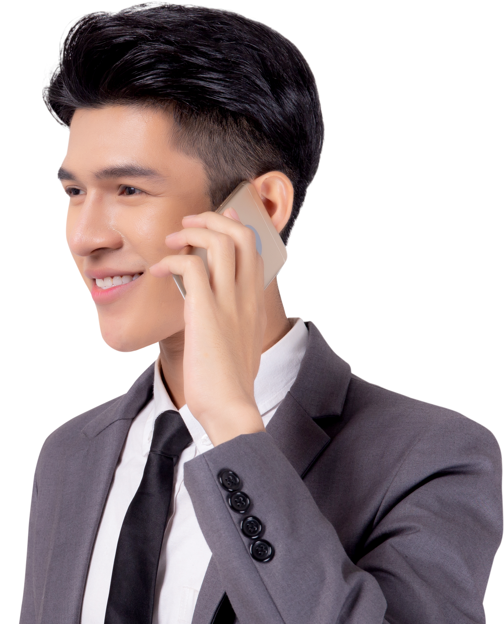 Un garçon en ensemble costume appelle avec son téléphone portable