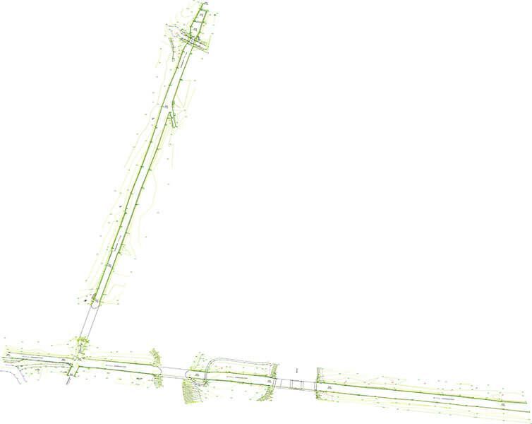 Grüne Punktwolkendaten, die eine L-förmige Struktur visualisieren, möglicherweise einen Tunnel oder eine Straße.