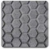 Un primer plano de un azulejo gris con un patrón de panal.