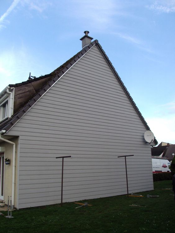 Façade de maison avec un bardage en fibre-ciment