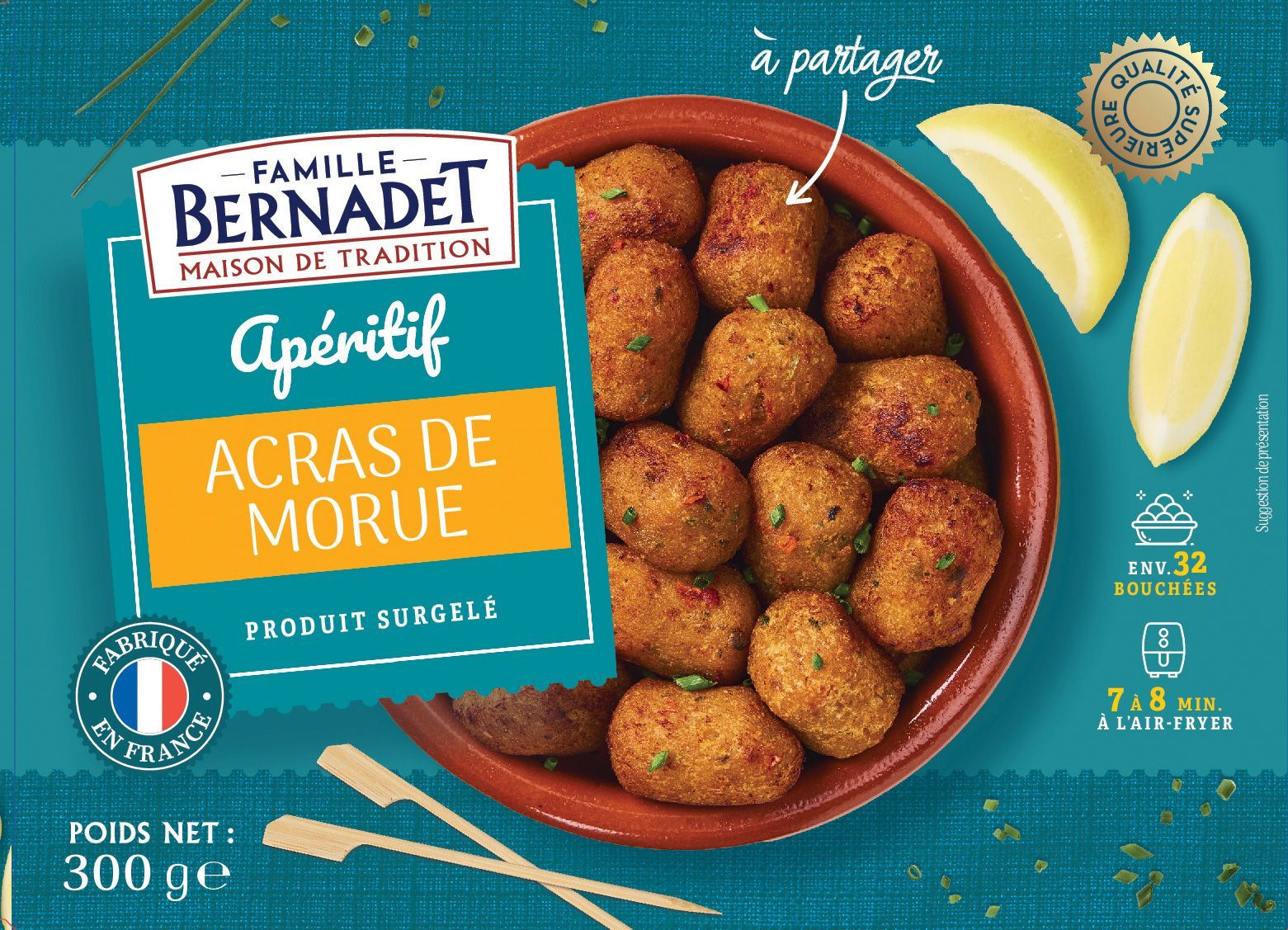 Emballage pour Pâmel BernaDet acras de morue, une boîte avec un bol de beignets de morue frits et des quartiers de citron.
