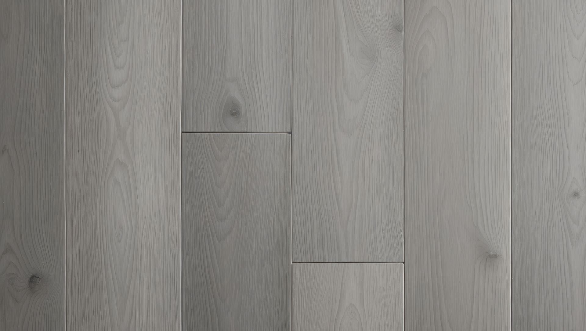 Planches de parquet en bois dur gris disposées verticalement.