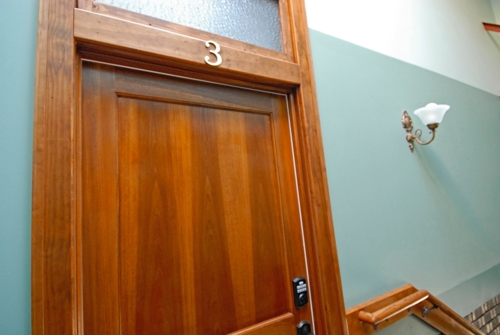 A wooden door with the number 3 on it