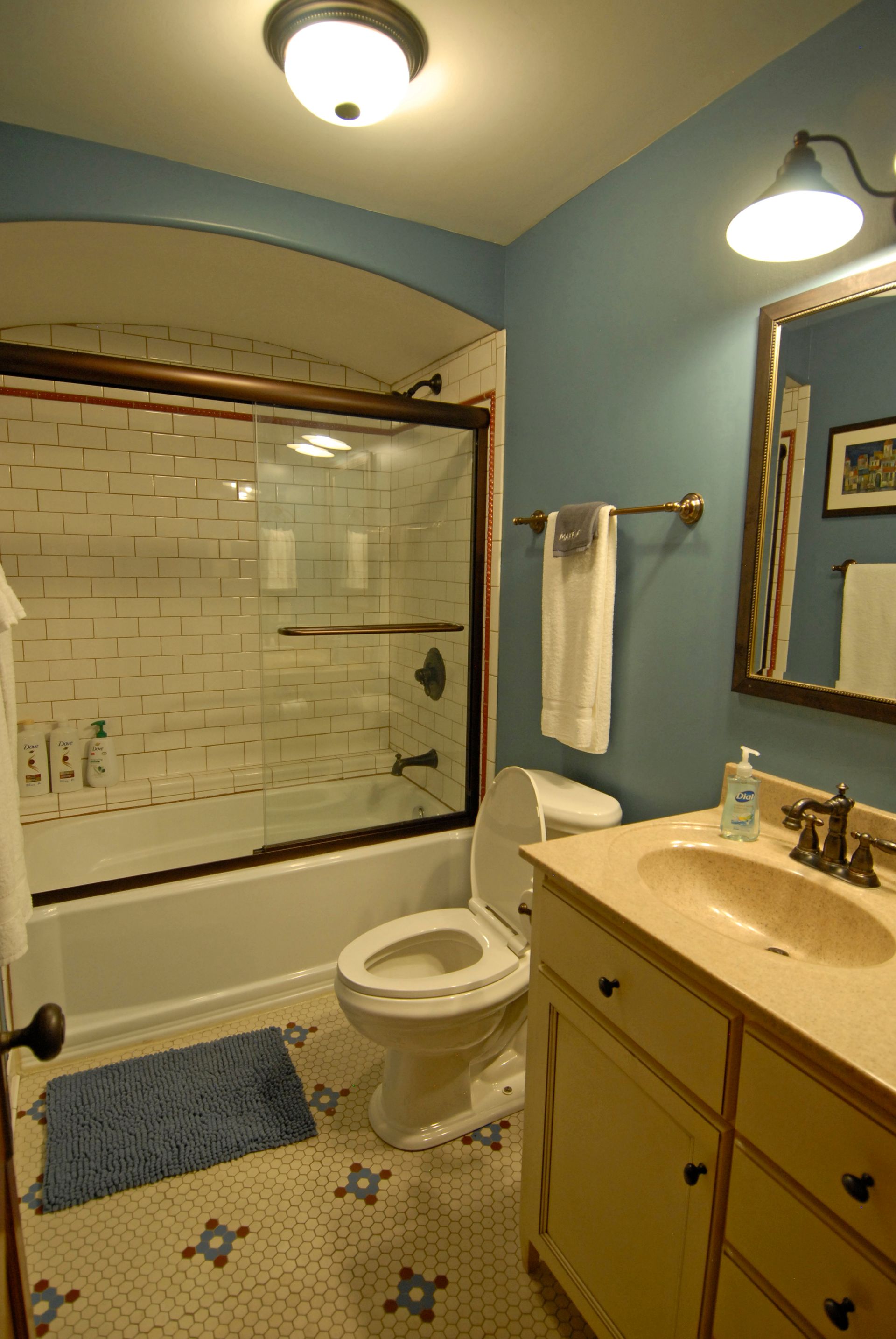 A bathroom with a toilet a sink and a bathtub