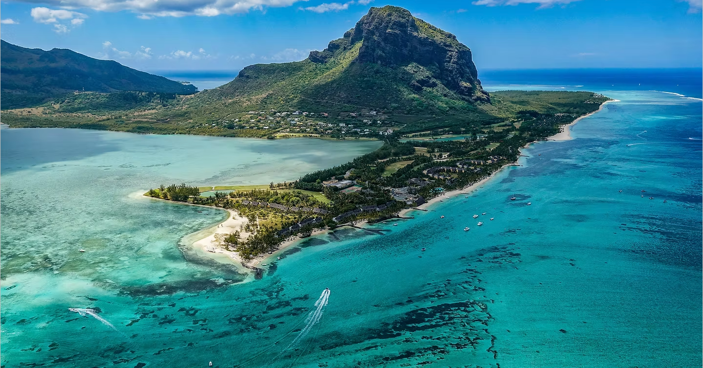 An aerial view of a small island in the middle of the ocean.