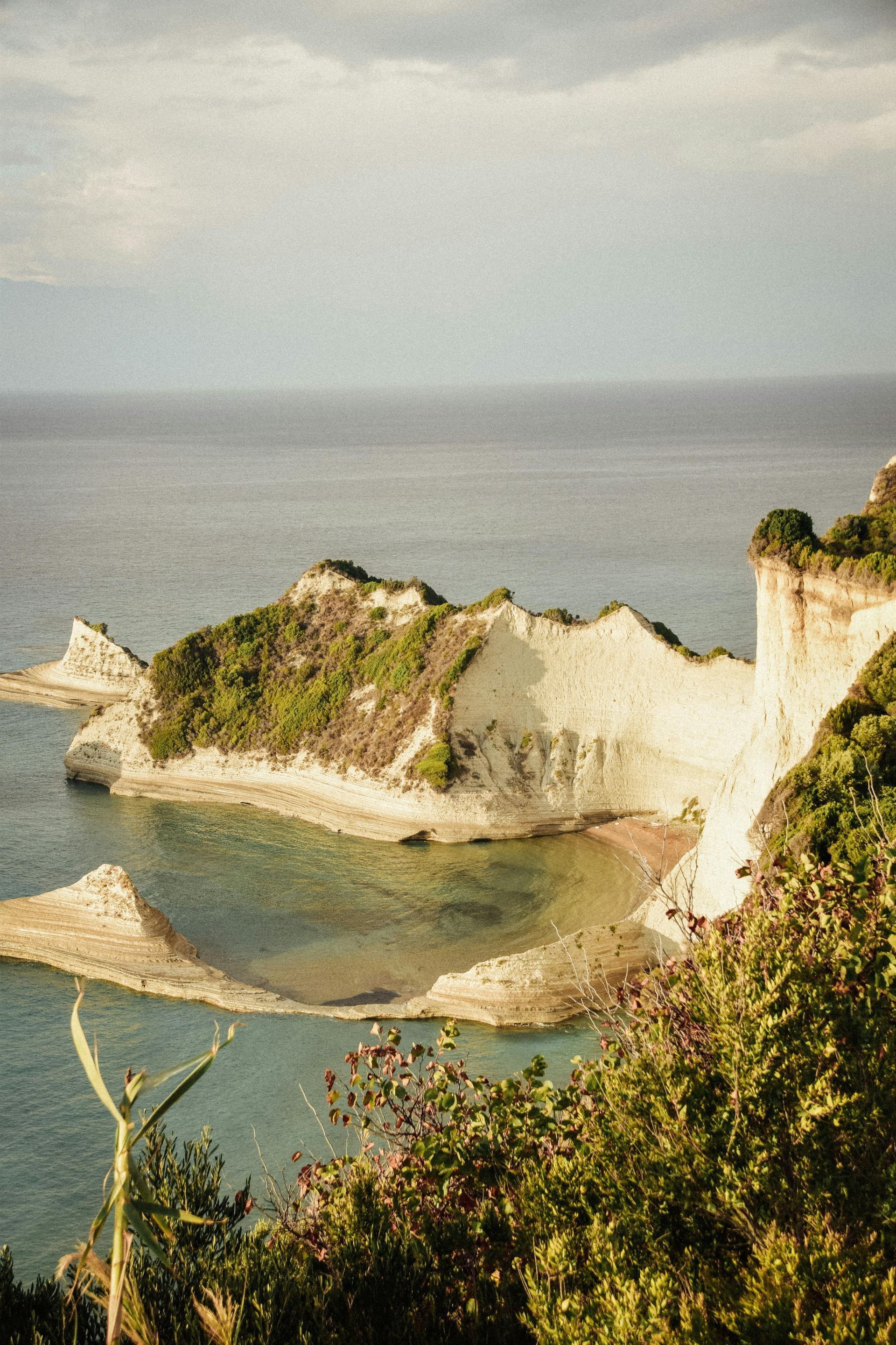 A view of a small island in the middle of the ocean