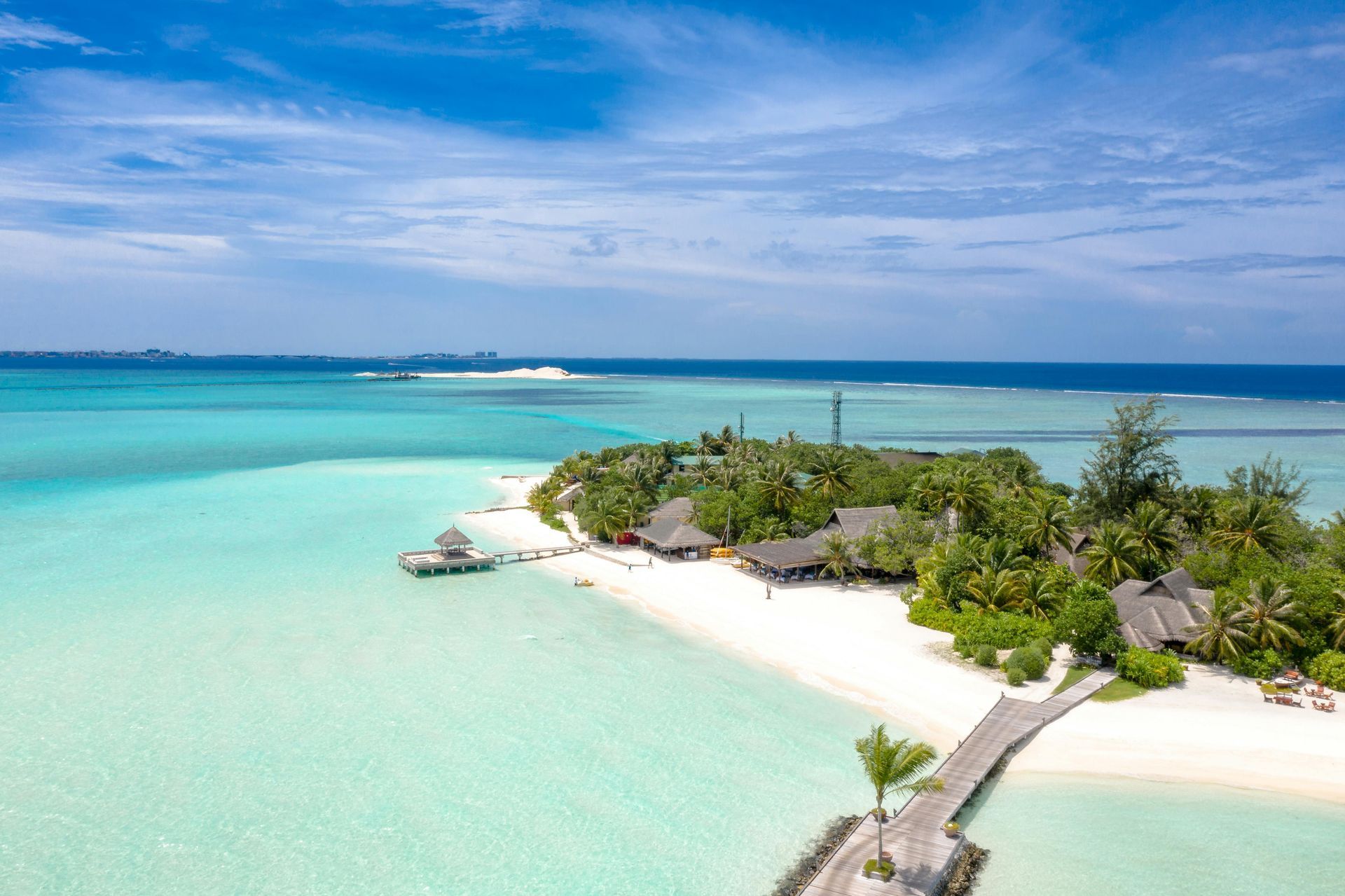 An aerial view of a small island in the middle of the ocean.