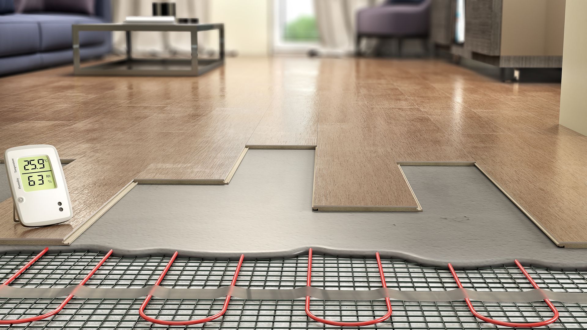 Pose de revêtement de sol avec une section de parquet soulevée, révélant les tuyaux de chauffage au sol et les panneaux d'isolation.