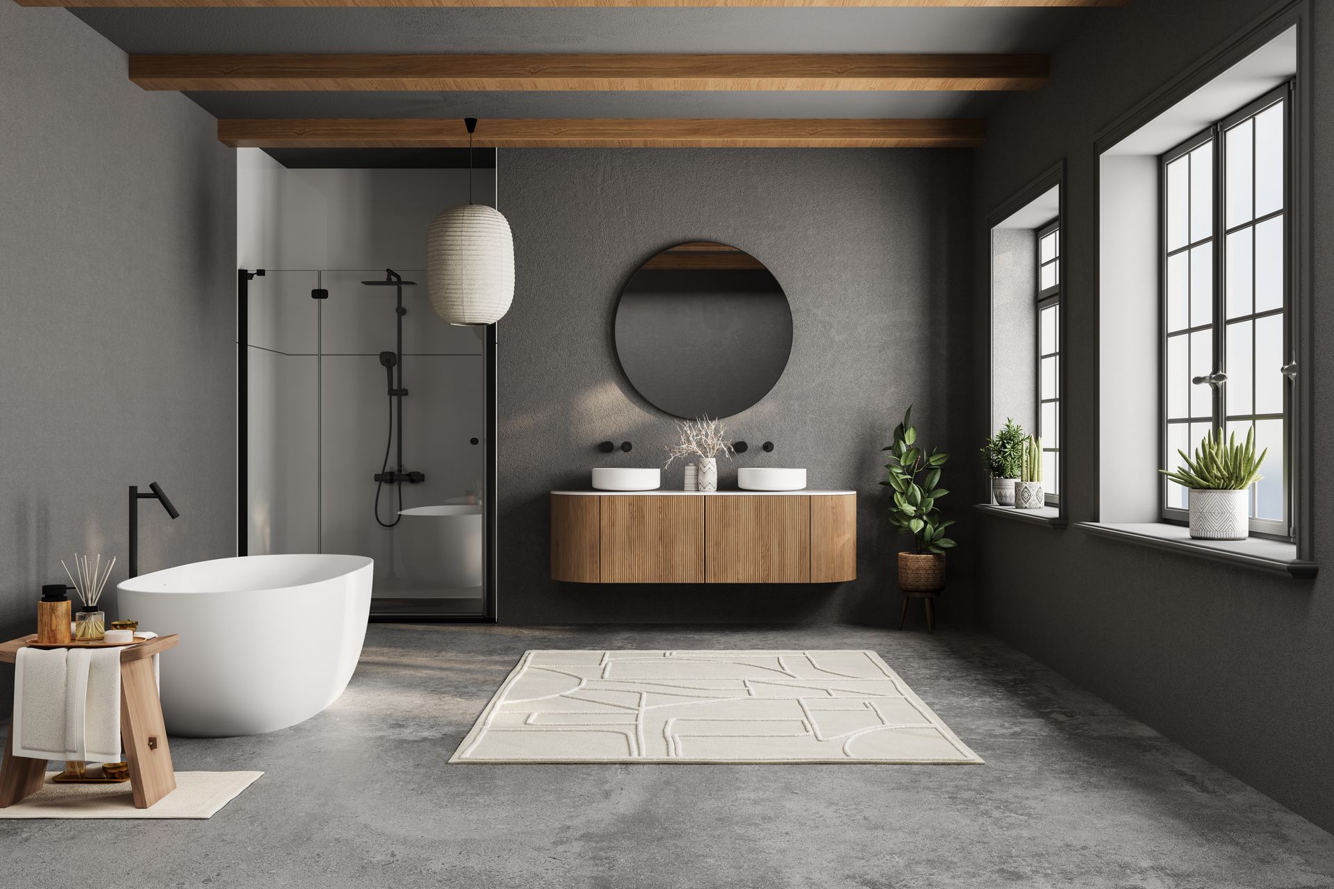 Salle de bains moderne grise avec baignoire îlot, meuble lavabo en bois, miroir rond et grandes fenêtres.