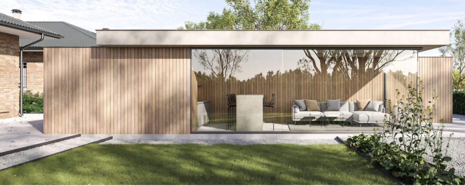 Un salon avec une verrière et des portes coulissantes en verre.