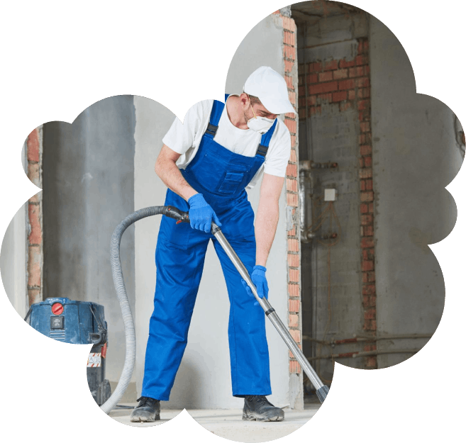 Person beim reinigen einer Baustelle