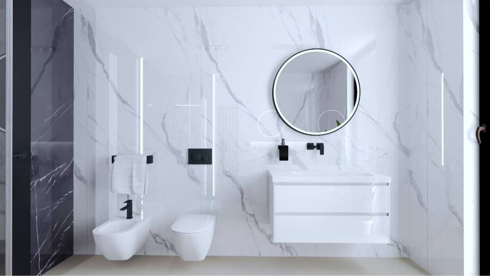 Modernes weisses Badezimmer mit wandhängendem WC, Bidet, Waschtisch und rundem Spiegel