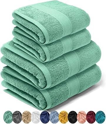 Cuatro toallas de baño de color verde menta apiladas, con una línea de muestras de color debajo.