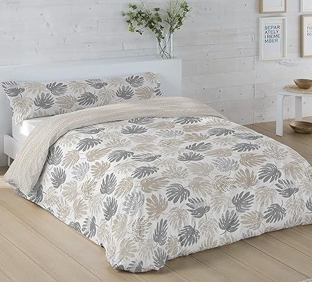 Cama con funda nórdica floral en tonos crema, gris y beige.