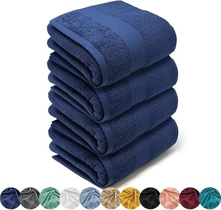 Pila de seis toallas de baño de color azul marino con una selección de muestras de color debajo.