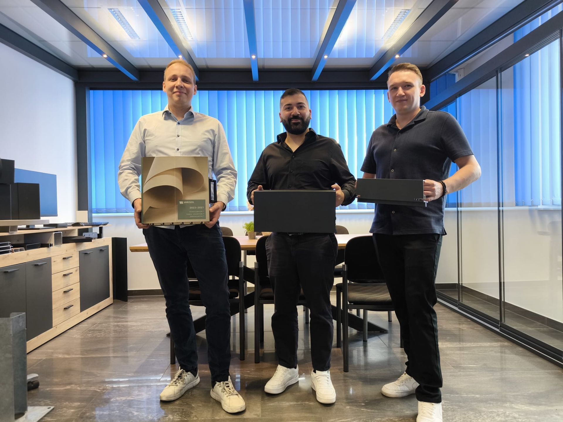 Blue-grey patio roof over a porch with chairs, near a house with a clear blue sky.