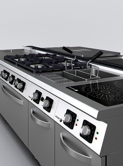 Una cocina con estufa, horno y fregadero.