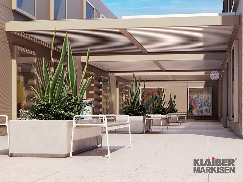 Eine künstlerische Darstellung einer Terrasse mit Pergola und Pflanzgefäßen.