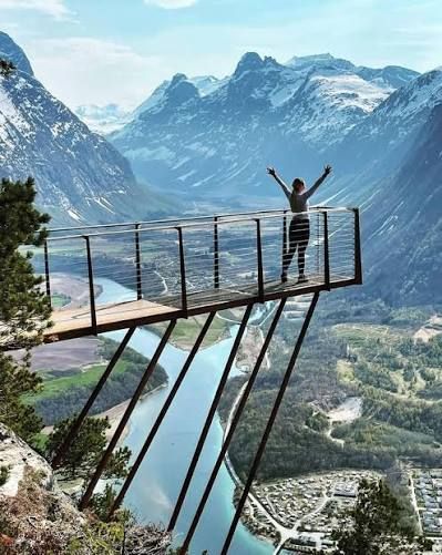 Hiker on the Rampestreken viewing platform above Åndalsnes