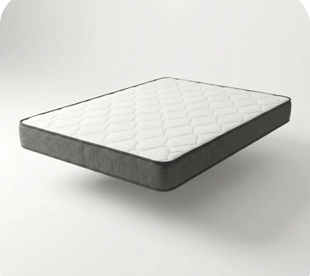 Un colchón blanco con un borde lateral gris oscuro que flota sobre un fondo gris claro.