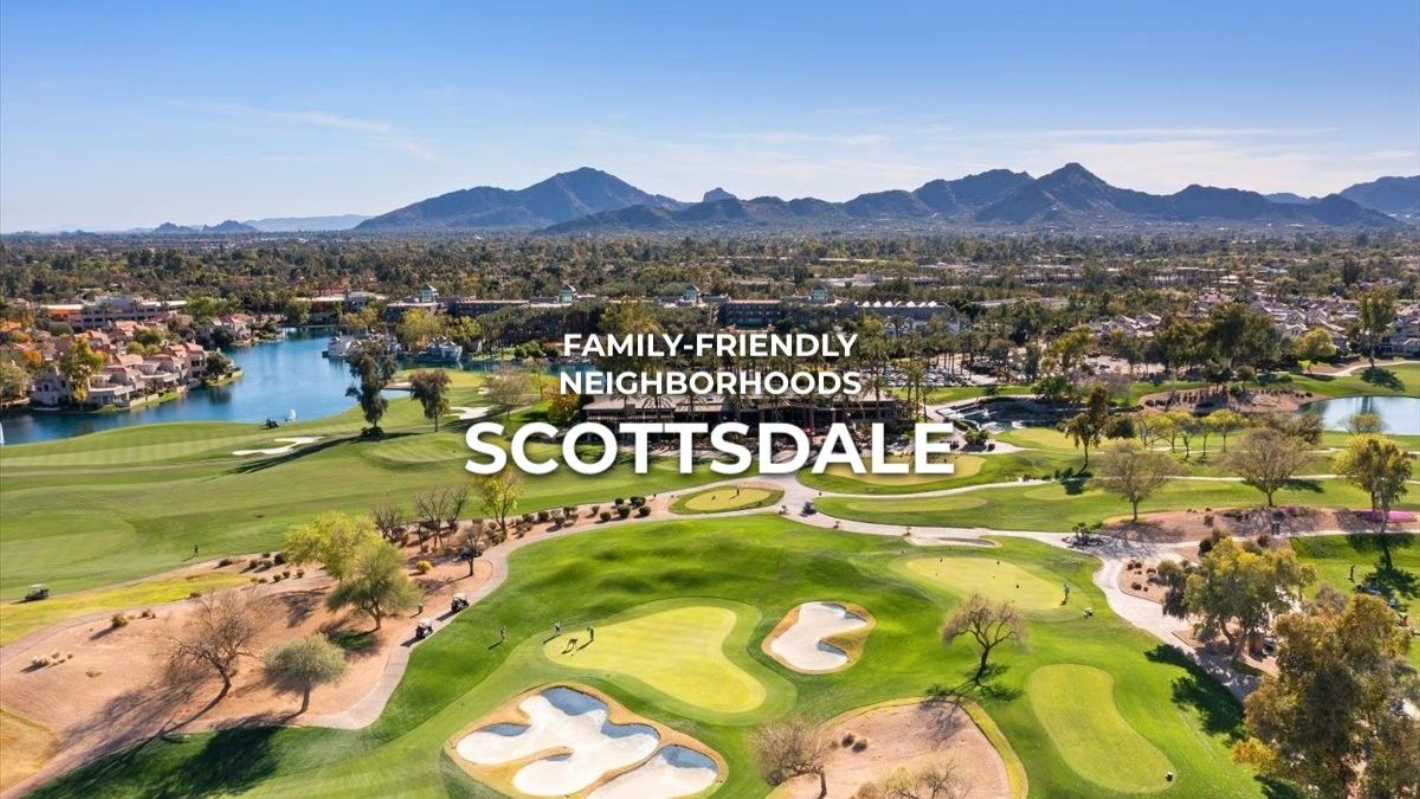 Aerial view of Scottsdale, Arizona, with a golf course, lake, and mountains in the background.